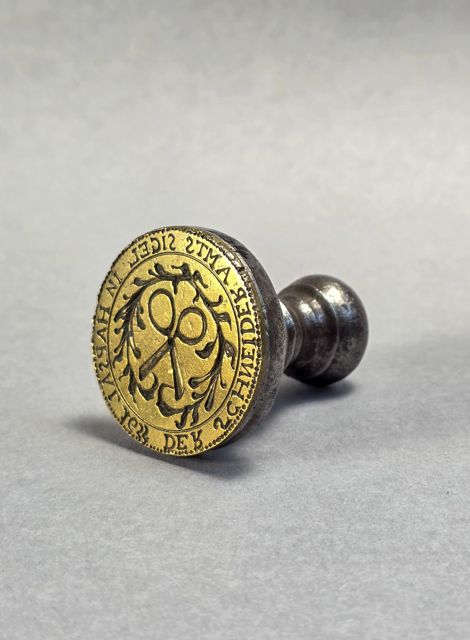 AN ESTONIAN TAILOR'S GUILD SEAL A 17TH CENTURY STEEL AND BRASS DESK SEAL
