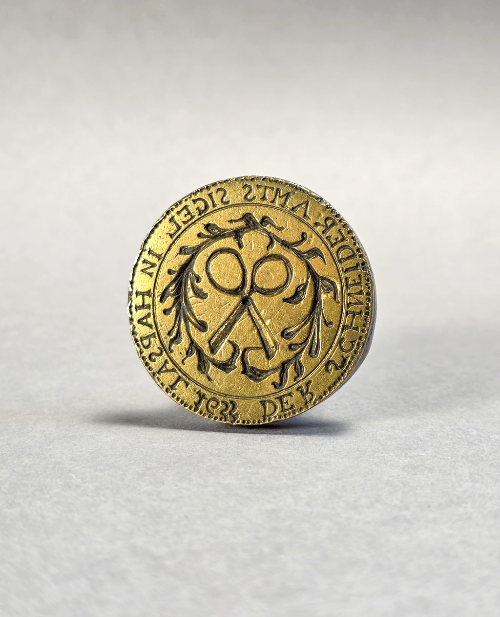 AN ESTONIAN TAILOR'S GUILD SEAL A 17TH CENTURY STEEL AND BRASS DESK SEAL