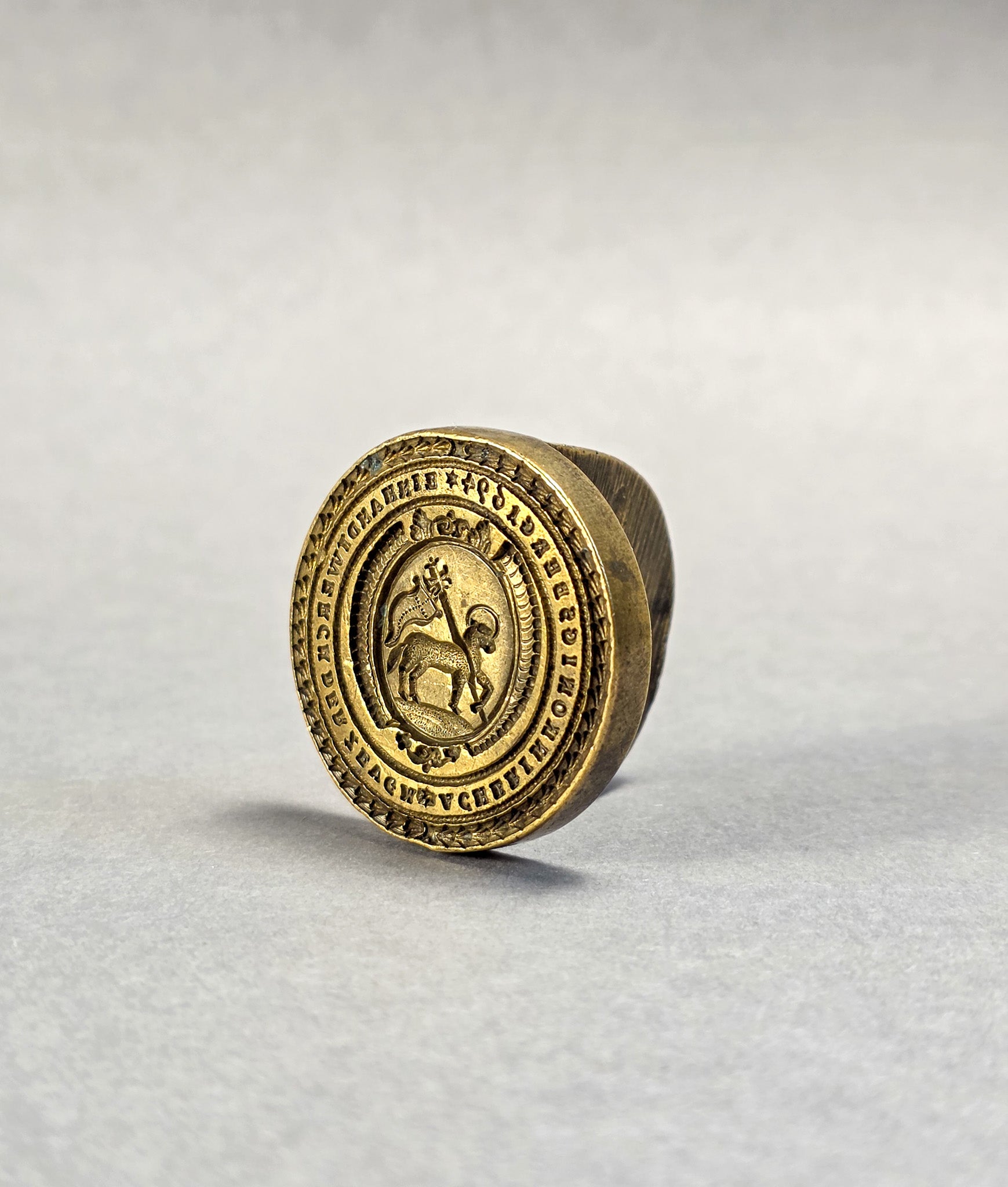 A BALTIC / RUSSIAN CLOTHMAKER SEAL A 17TH CENTURY LAMB OF GOD BRASS DESK SEAL