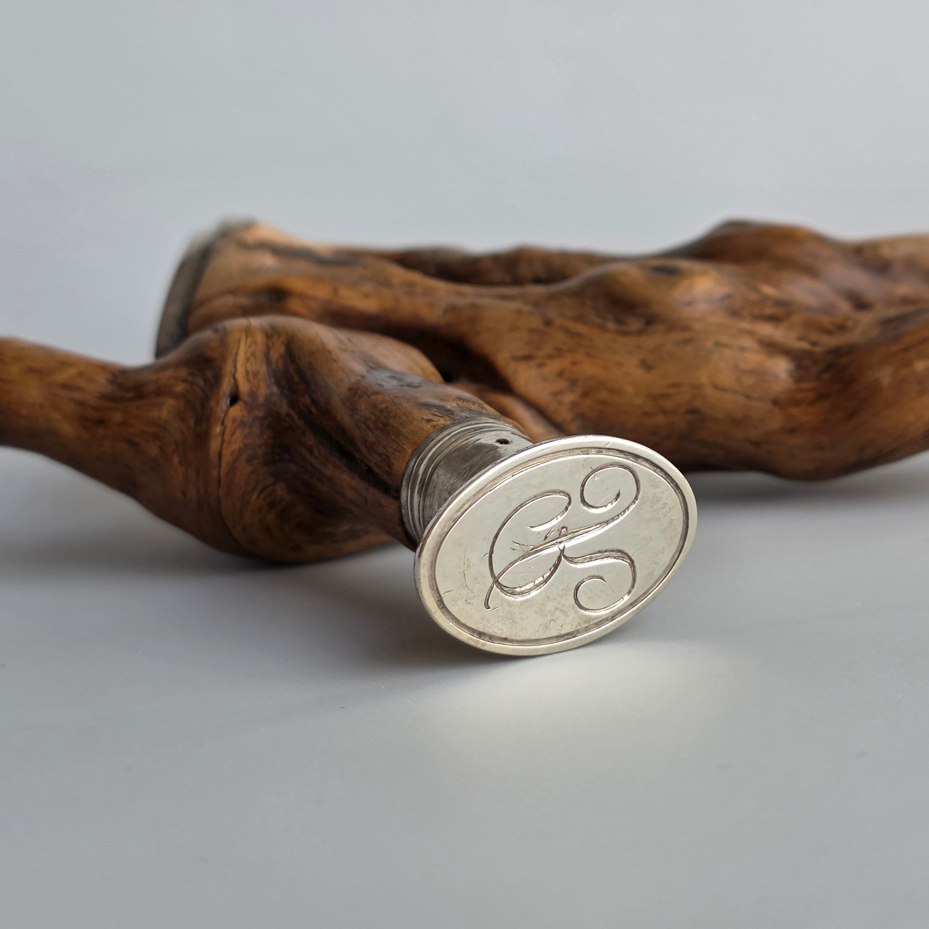 A WHIMSICAL SILVER-MOUNTED ROOTWOOD EXTRAVAGANZA INCORPORATING TWO SEAL MATRICES