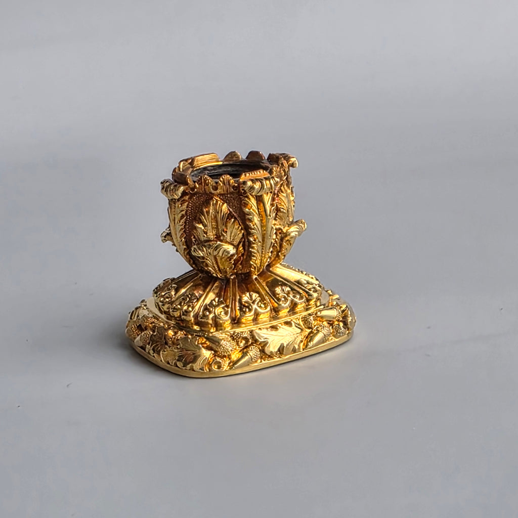 AN ENGLISH GOLD & CARNELIAN ARMORIAL DESK SEAL