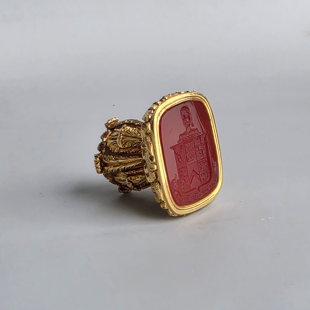 AN ENGLISH GOLD & CARNELIAN ARMORIAL DESK SEAL