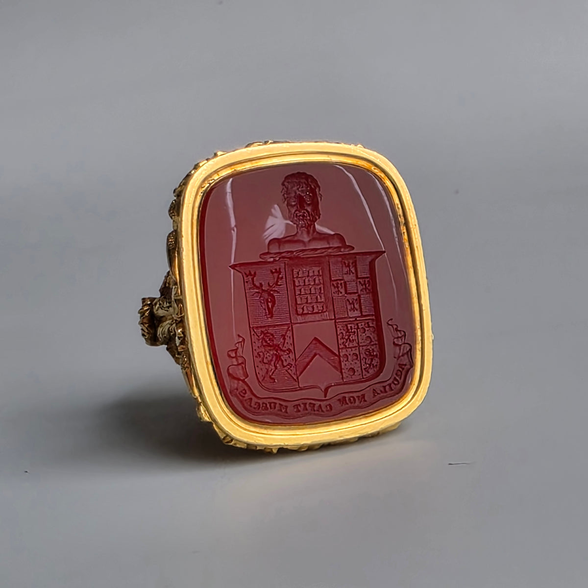 AN ENGLISH GOLD & CARNELIAN ARMORIAL DESK SEAL