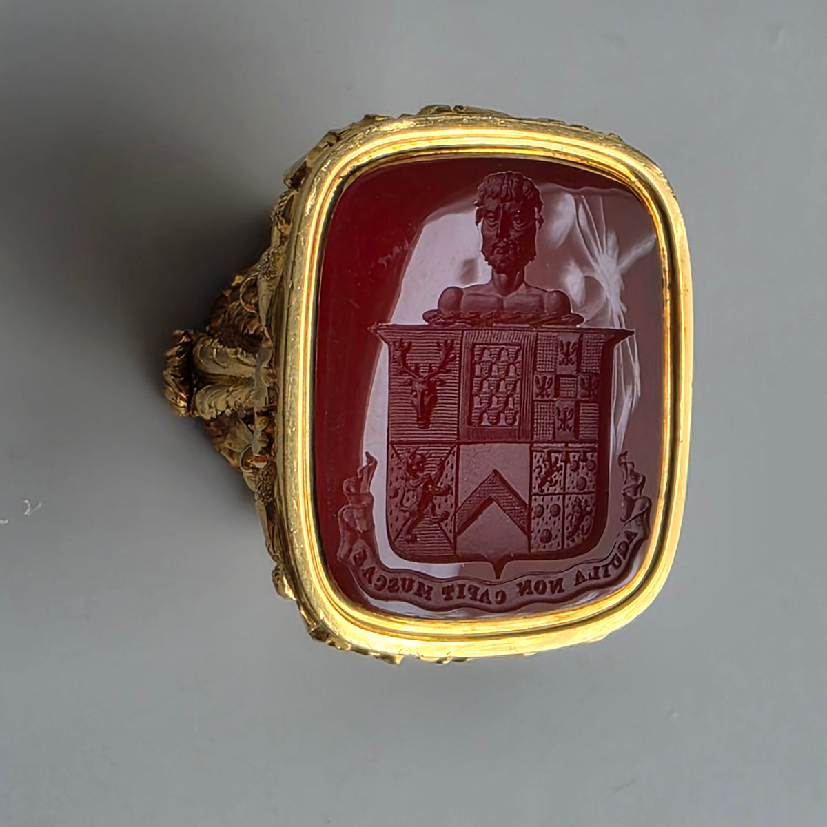 AN ENGLISH GOLD & CARNELIAN ARMORIAL DESK SEAL