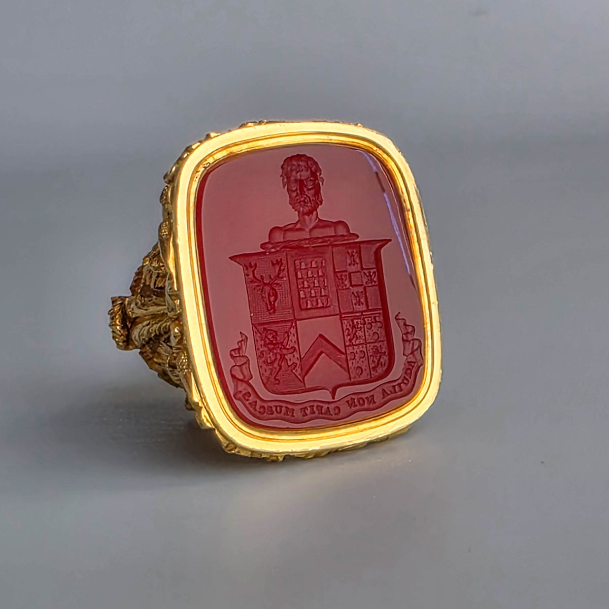 AN ENGLISH GOLD & CARNELIAN ARMORIAL DESK SEAL