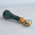 A GOLD-MOUNTED ENGLISH HARDSTONE TRIPLE-SWIVEL DESK SEAL