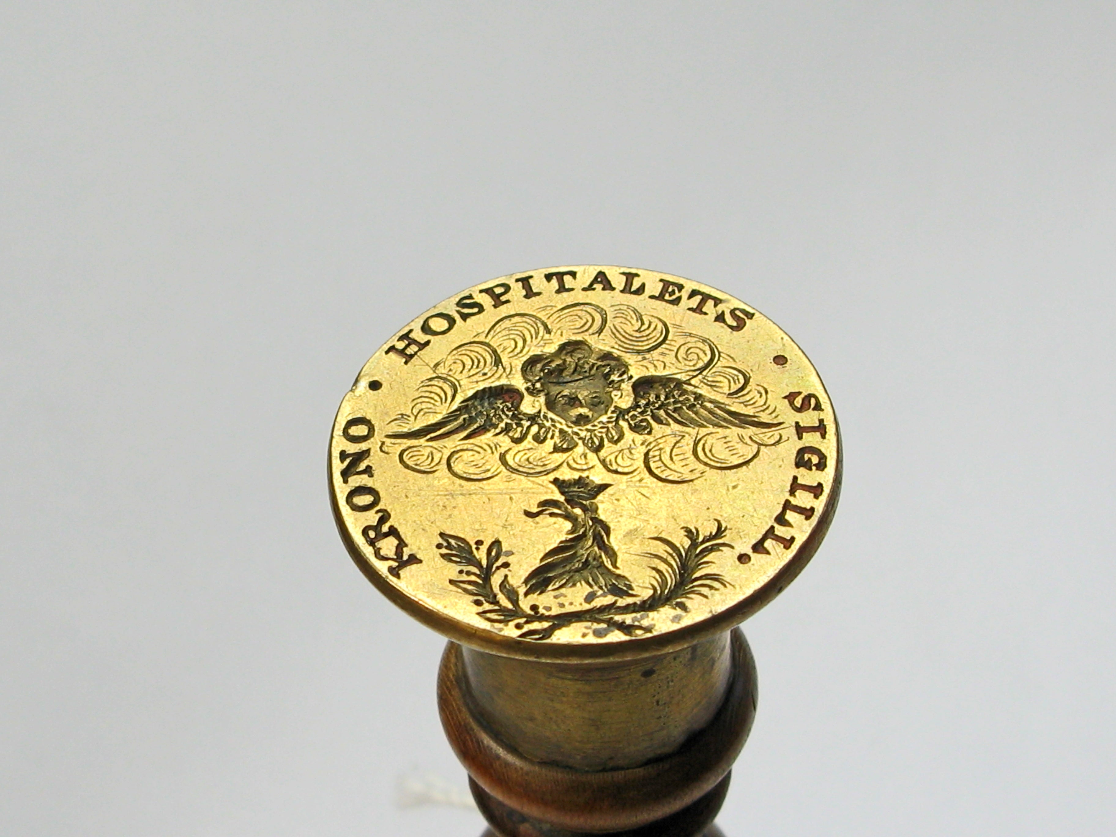 A WOOD AND BRASS SWEDISH HOSPITAL DESK SEAL