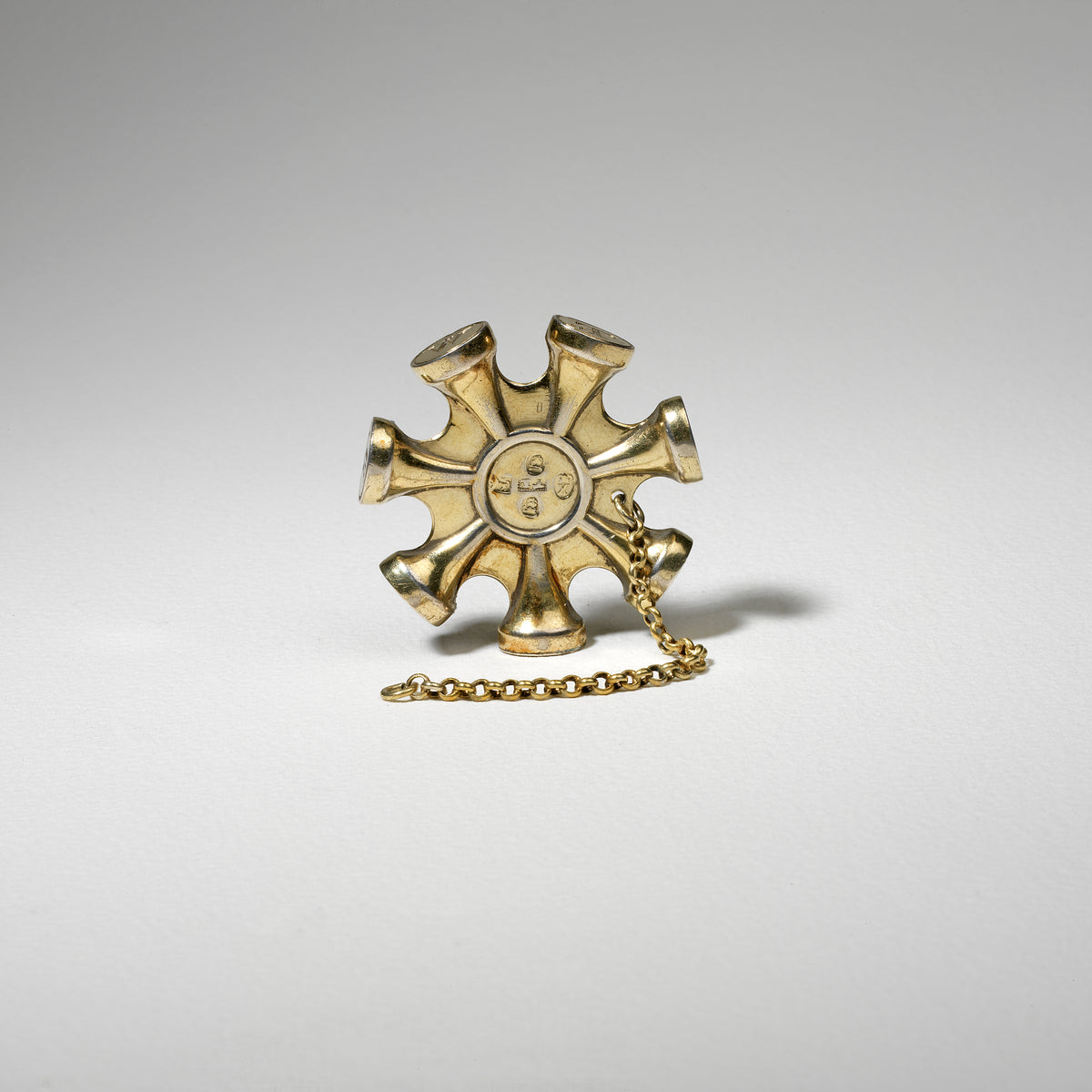 A SEVEN -SIDED SILVER-GILT SEAL