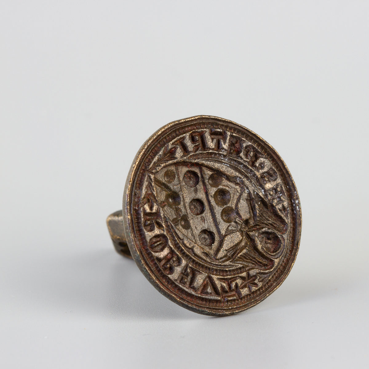 Matrix of antique wax seal with armorial and angel
