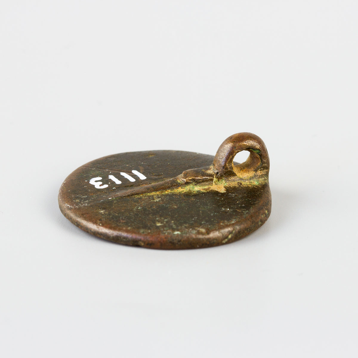 Reverse of bronze wax seal showing suspension loop