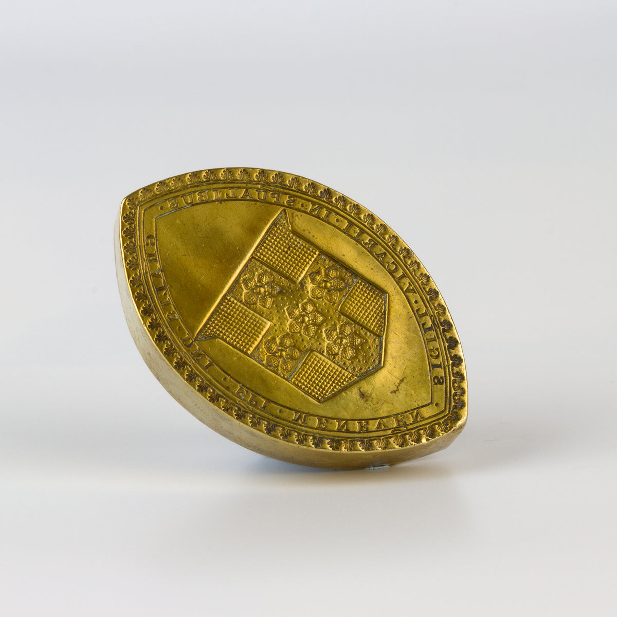 Side view of brass ecclesiastical wax seal
