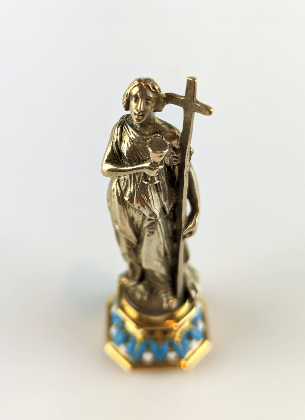 Top of antique silver lady holding cross wax seal