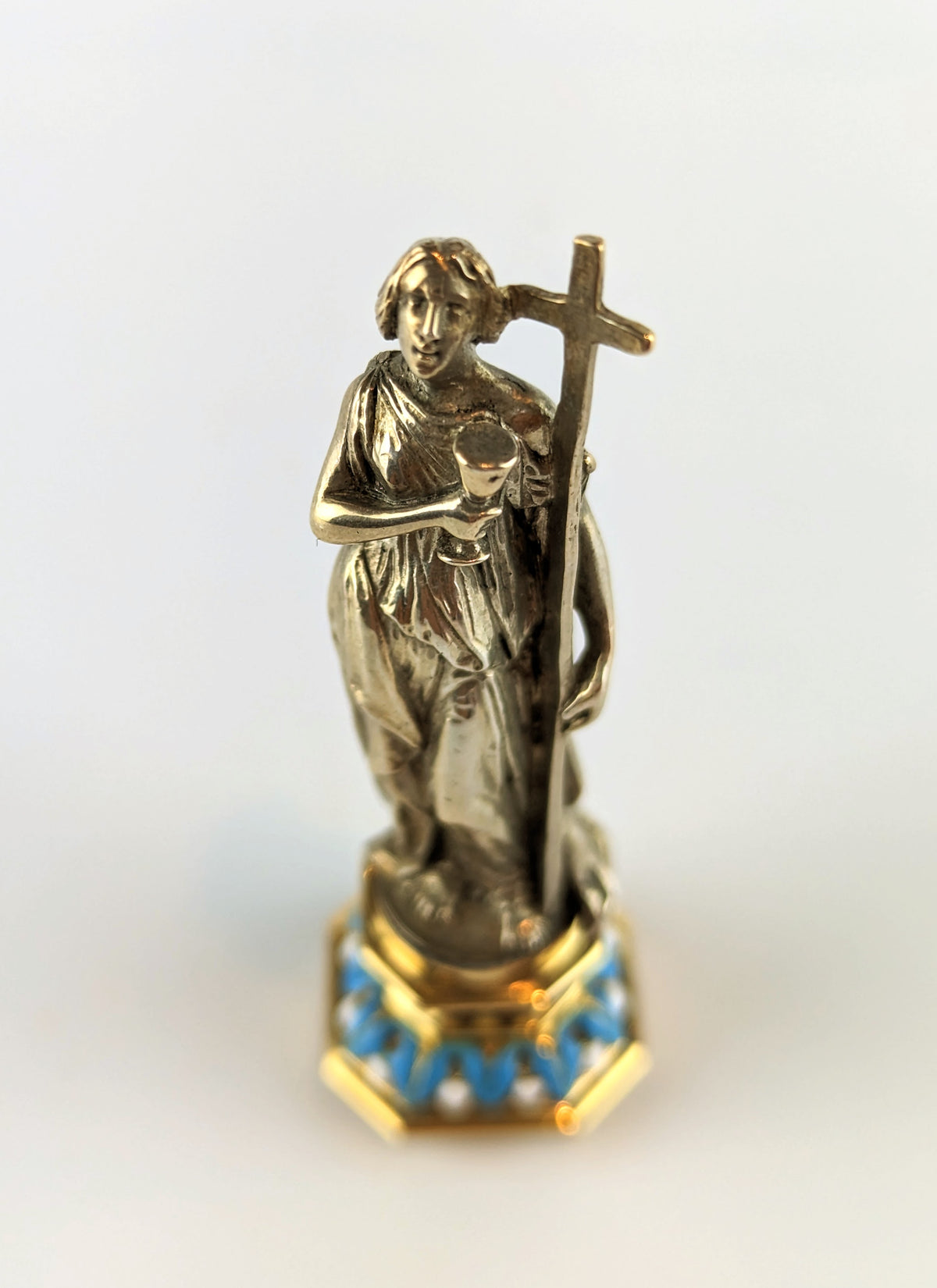 Top of antique silver lady holding cross wax seal