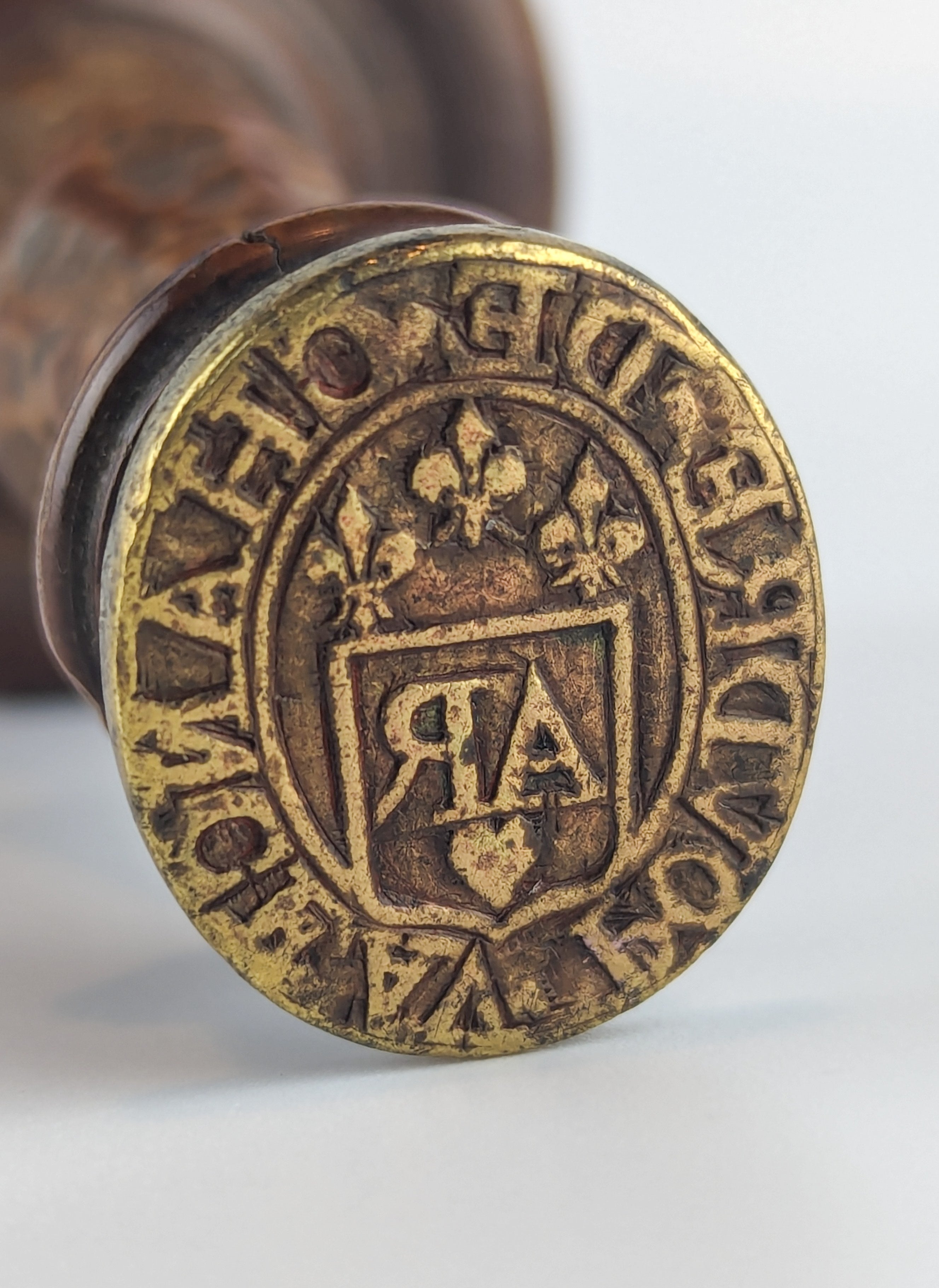 Detail of brass matrix of desk stamp