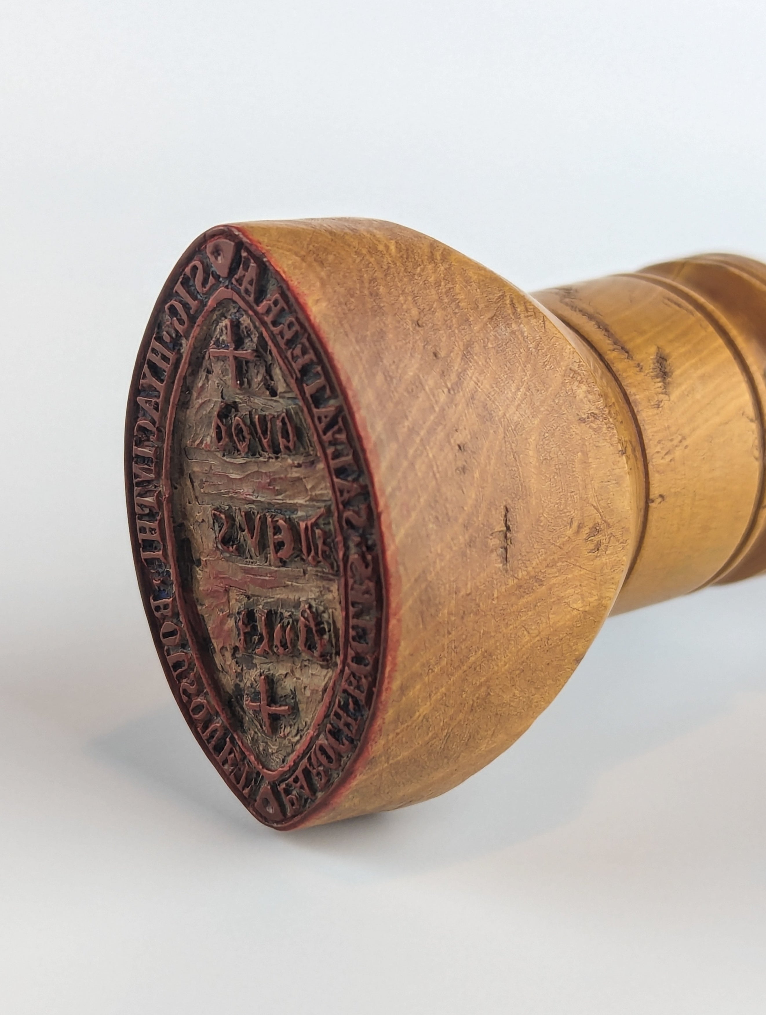 On end view of antique wax desk stamp matrix