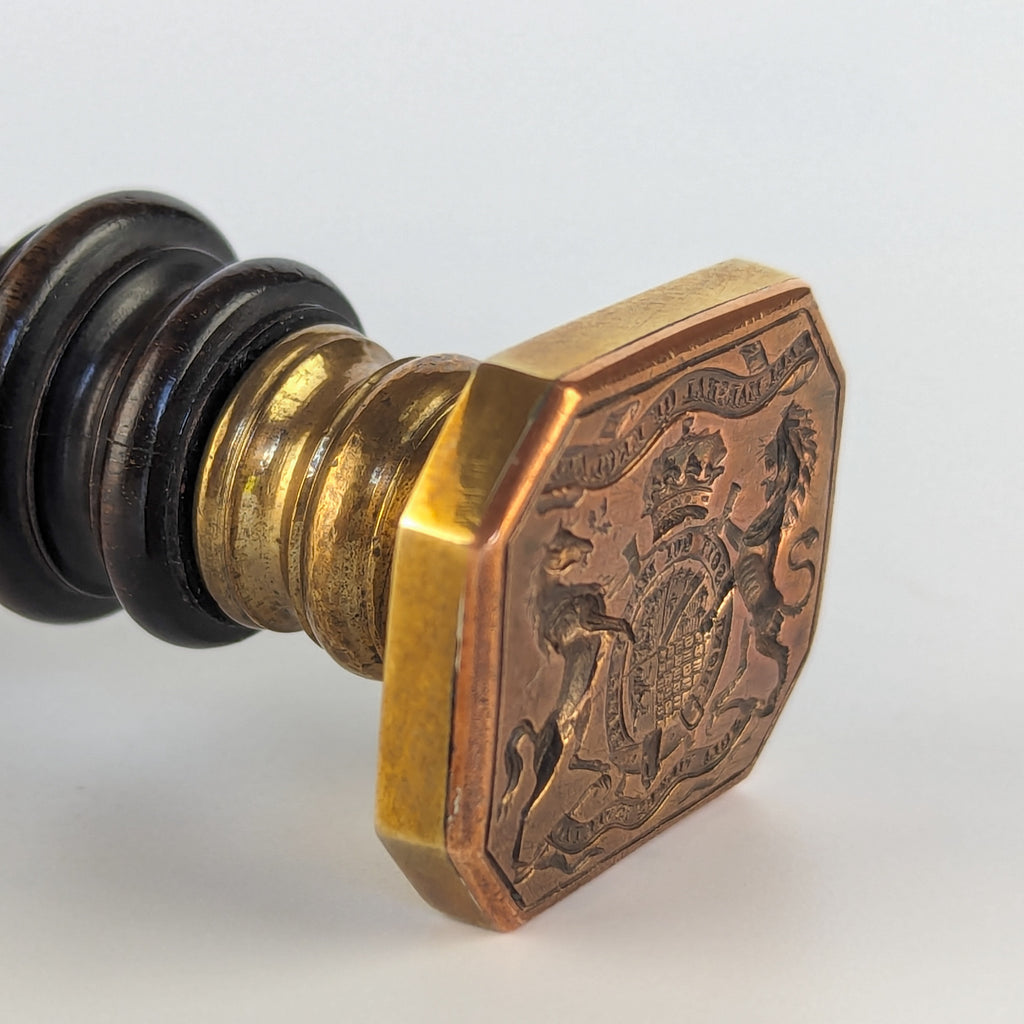 Copper matrix and black wood handle on wax seal