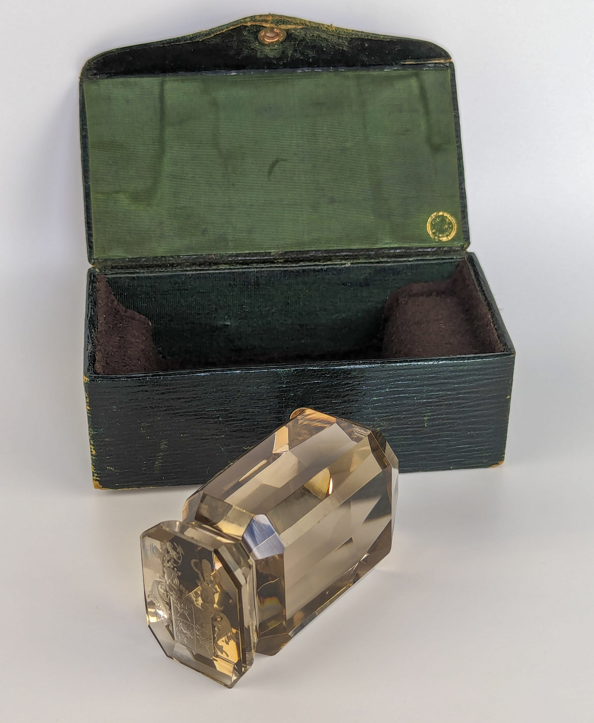 Antique wax seal and black leather case open