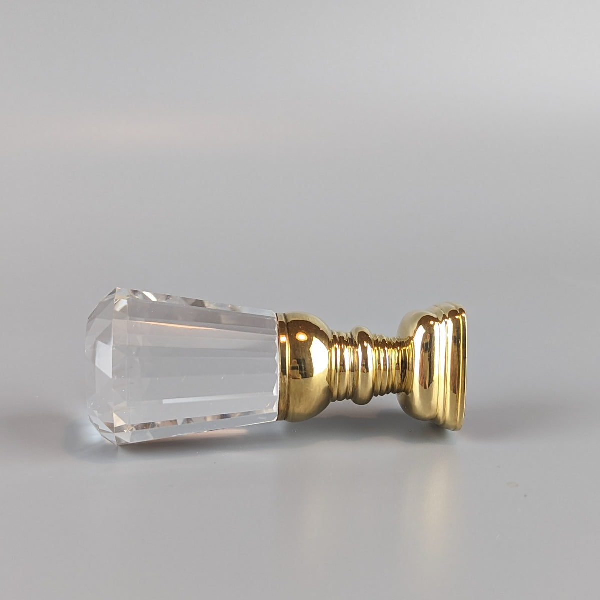 Side view of crystal and gold wax seal