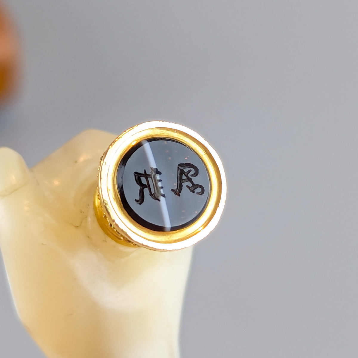 Closeup of small matrix on mother of pearl hand wax seal