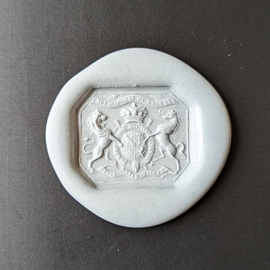 Wax impression of desk seal with armorial and motto