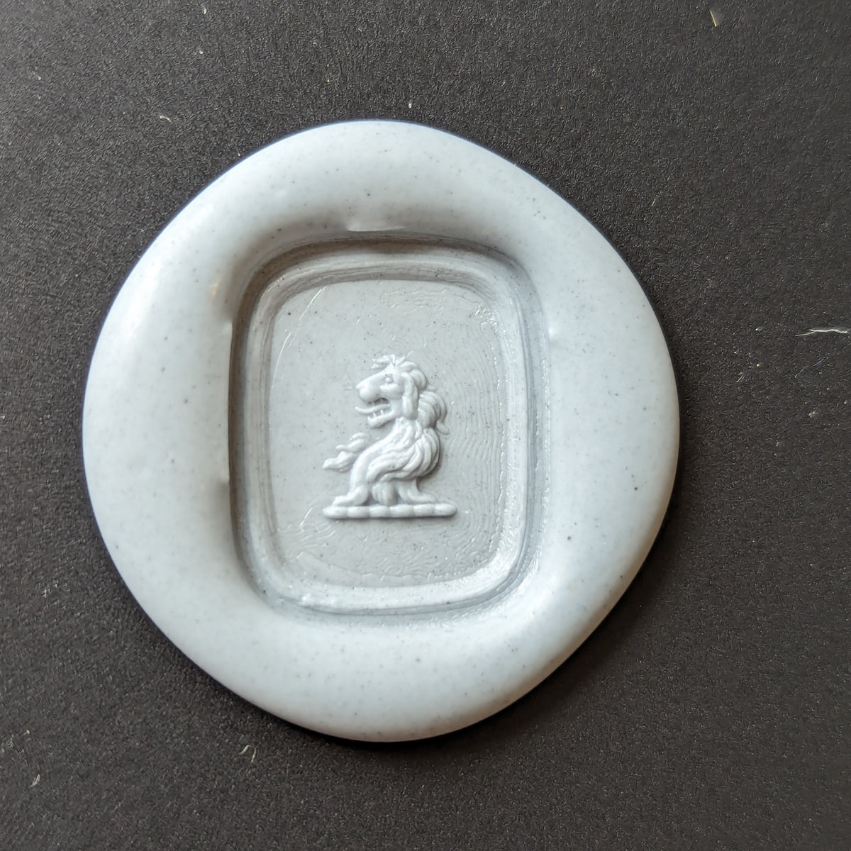 Wax impression of lion armorial on wax seal