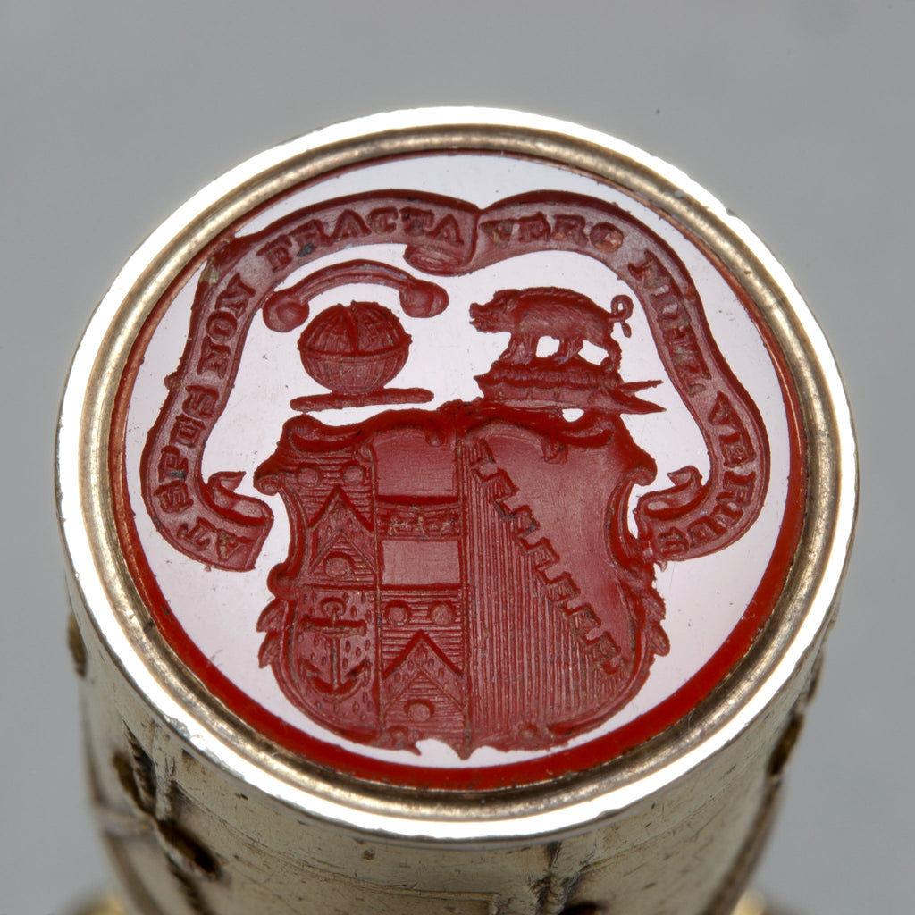 Engraved carnelian matrix of crests and arms with motto