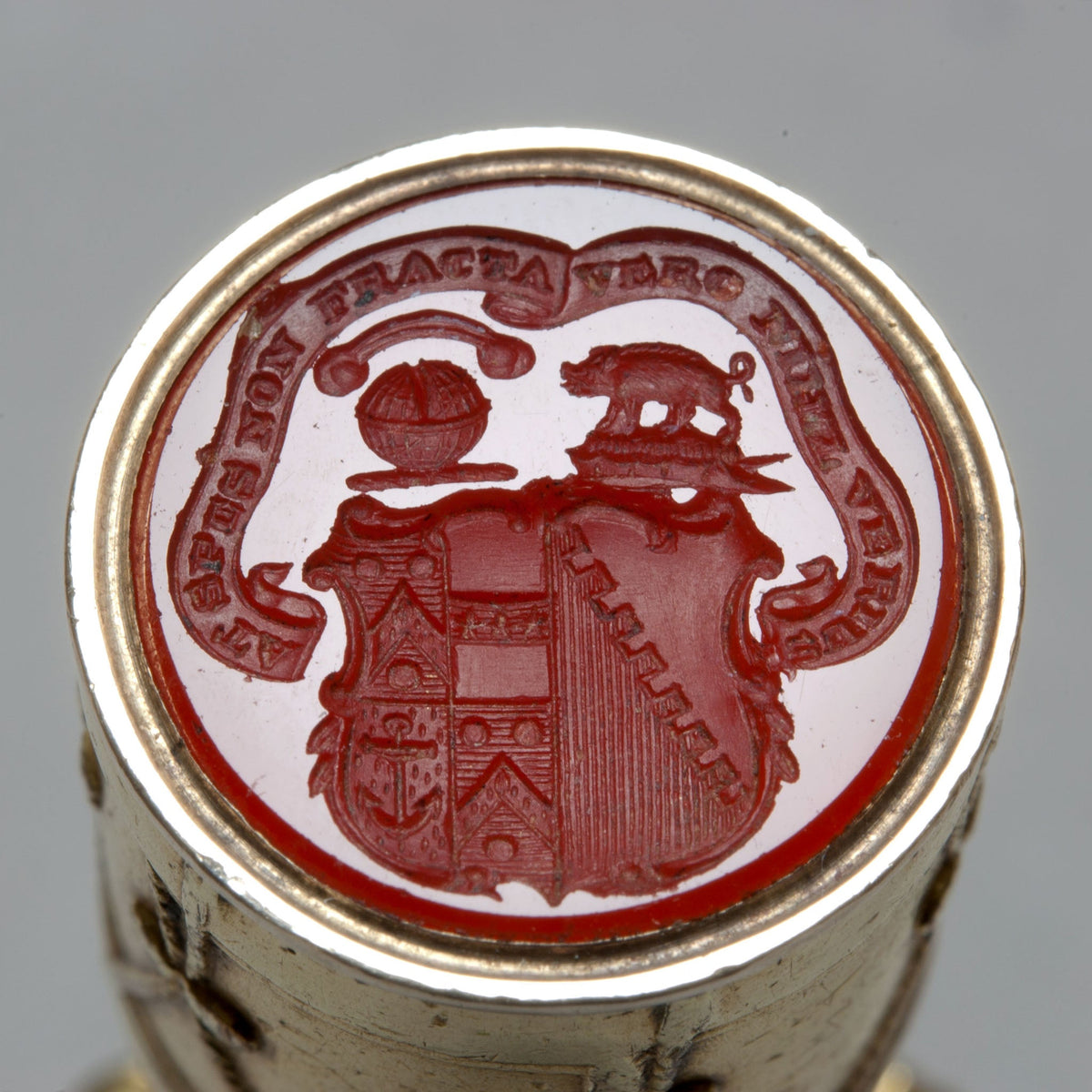 Engraved carnelian matrix of crests and arms with motto