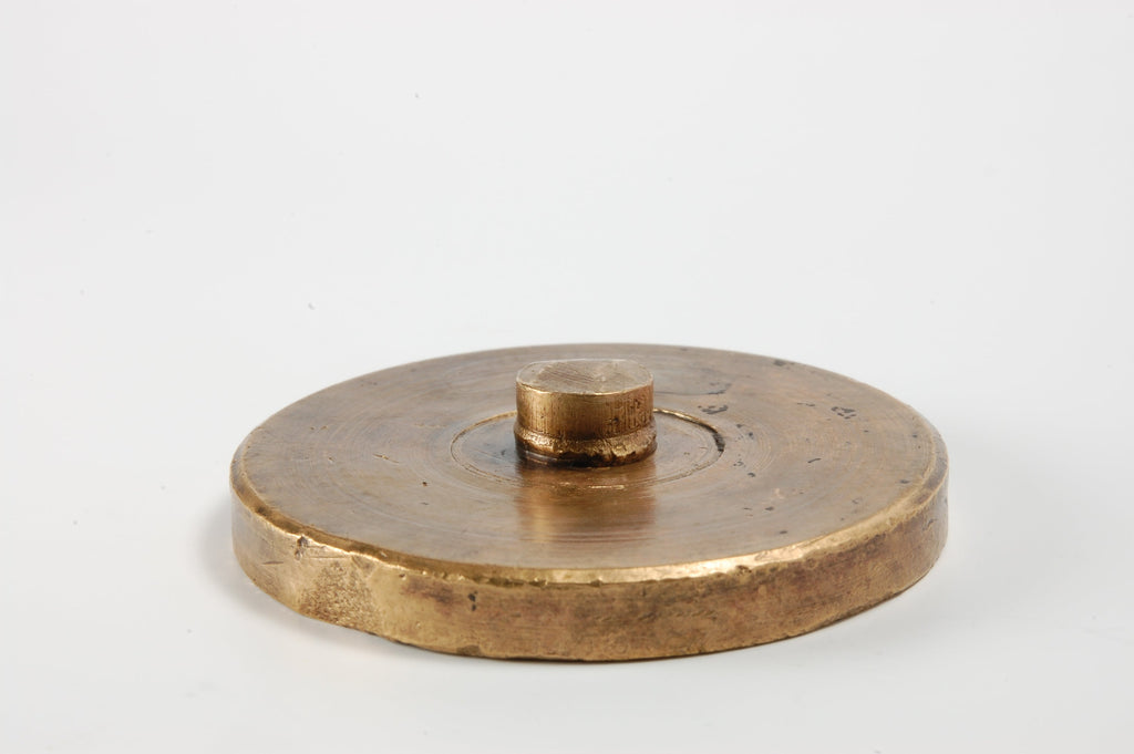 Reverse of antique brass desk seal