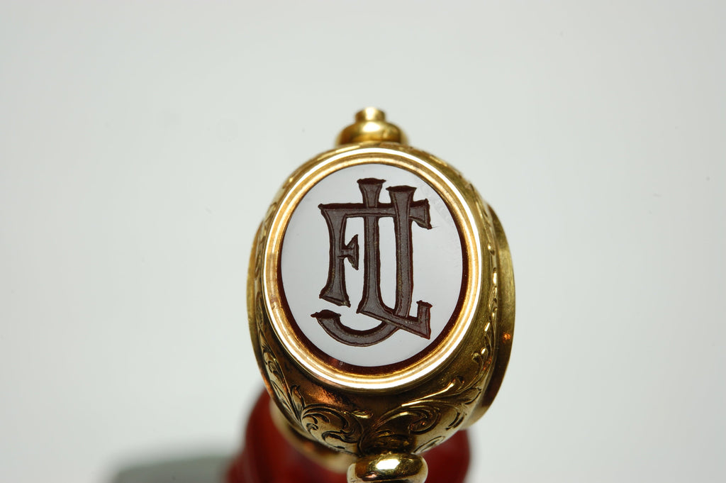 Gold mounted wax seal matrix engraved with three initials FLJ