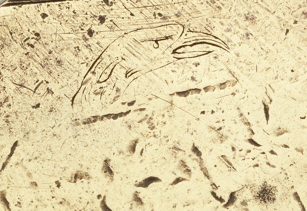 Detail of engraving on brass wax seal matrix showing eagle's head