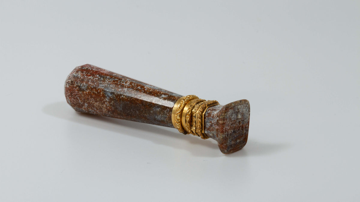 three quarter view of gold and jasper desk seal