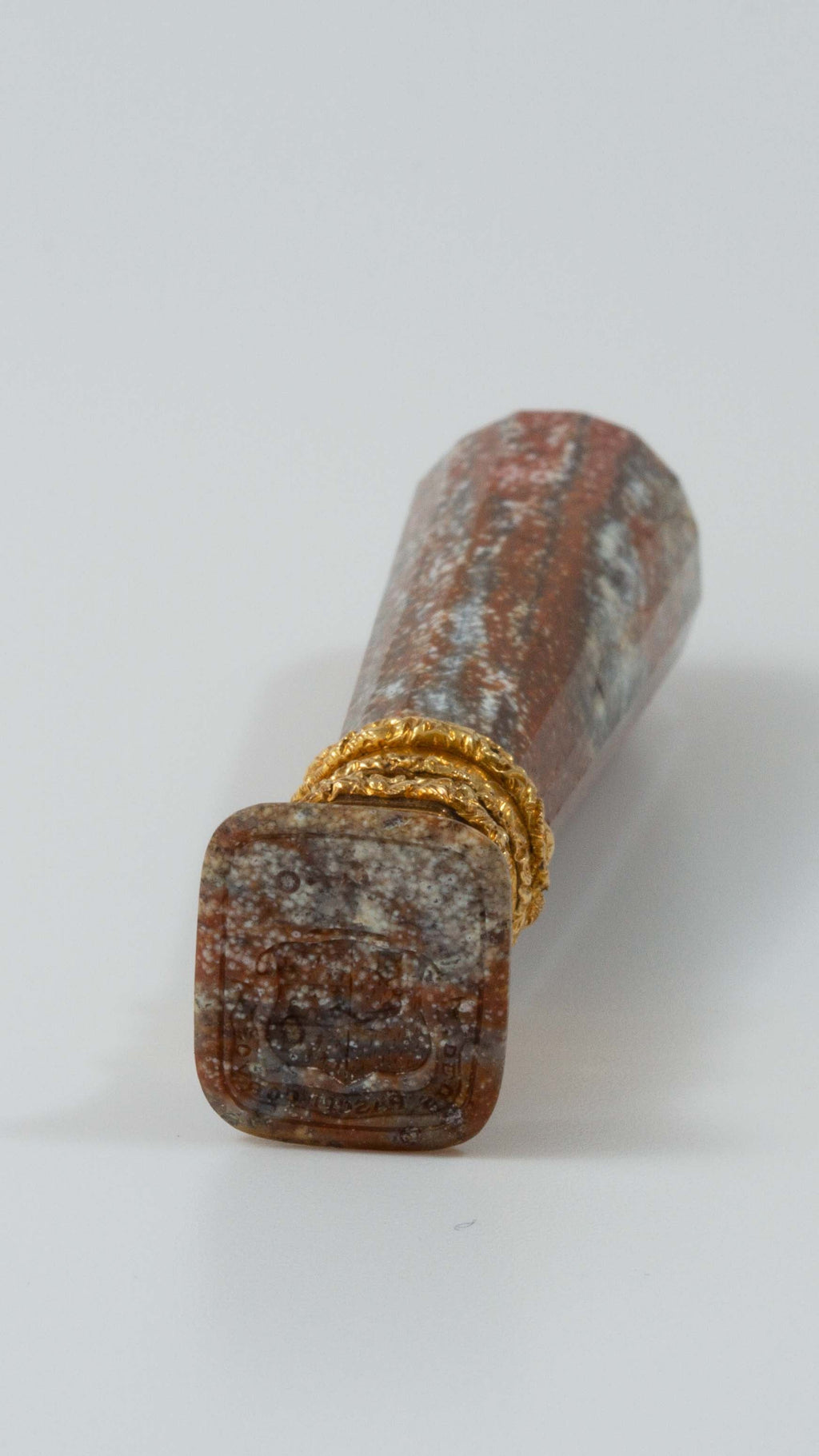 Head on view of jasper and gold desk seal