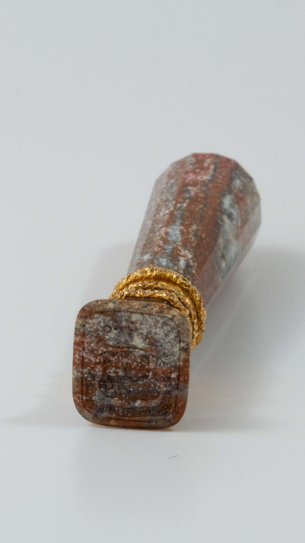 Head on view of jasper and gold desk seal