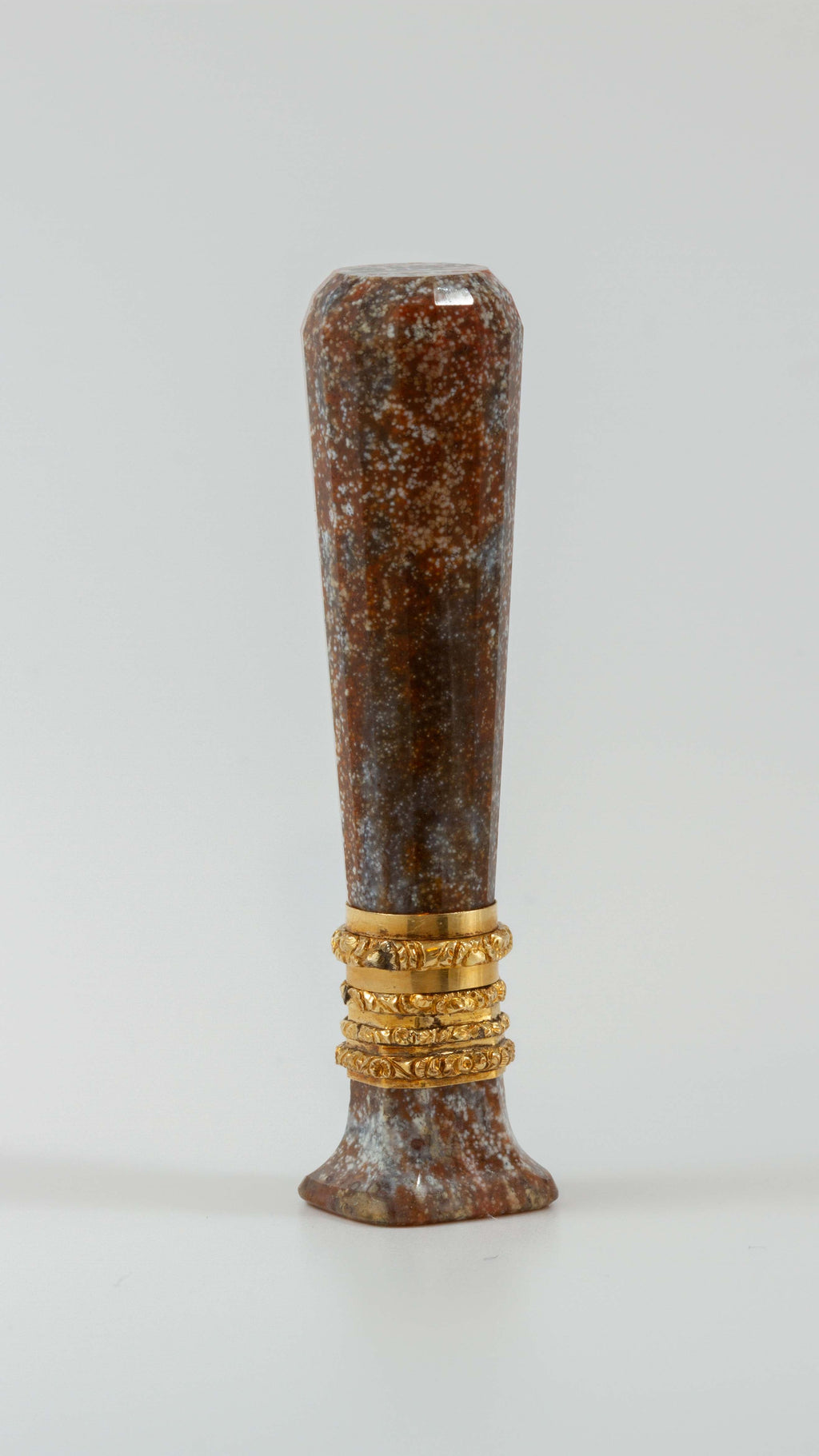 Vertical view of gold and jasper desk seal