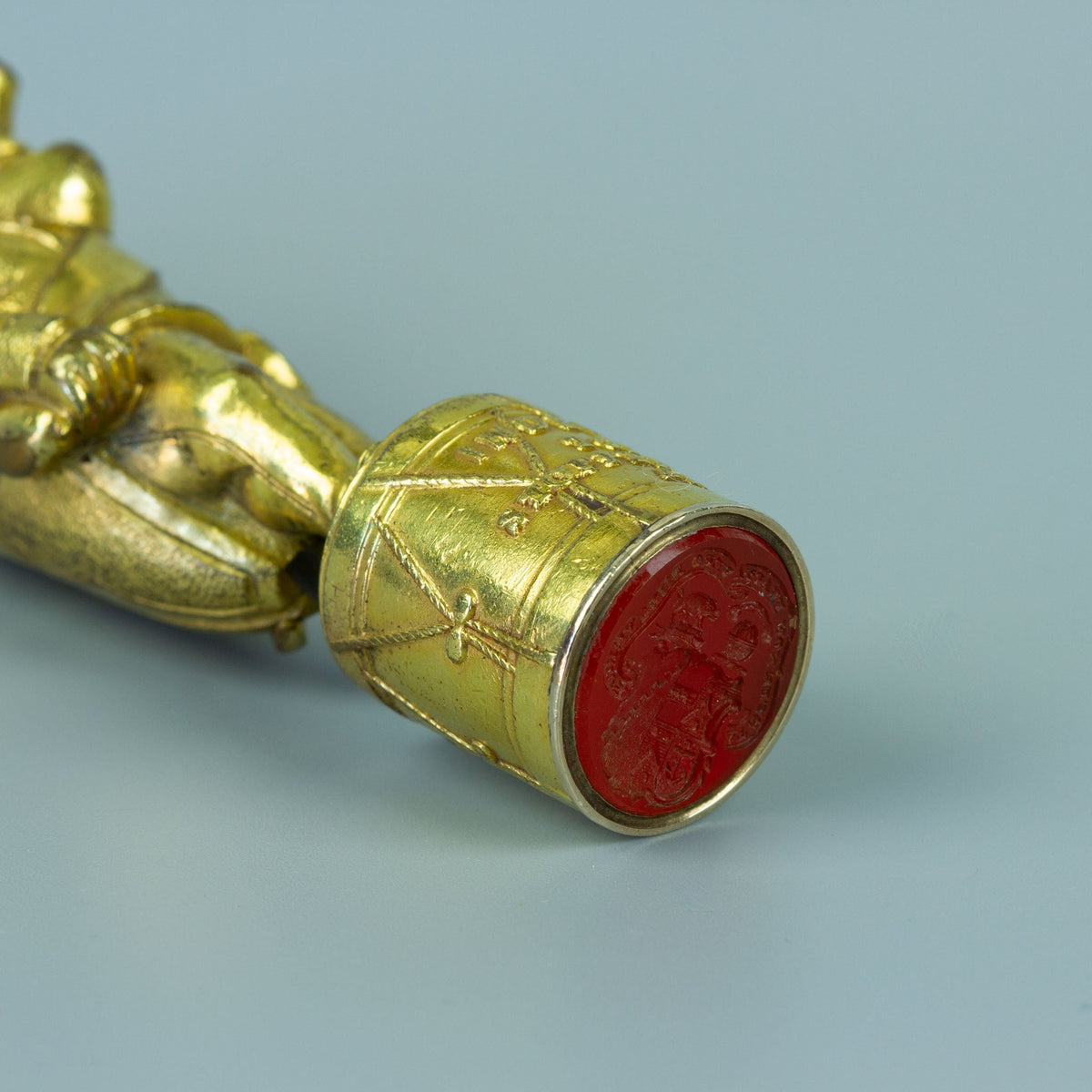 Close up of wax seal base made in the form of a drum with a carnelian matrix