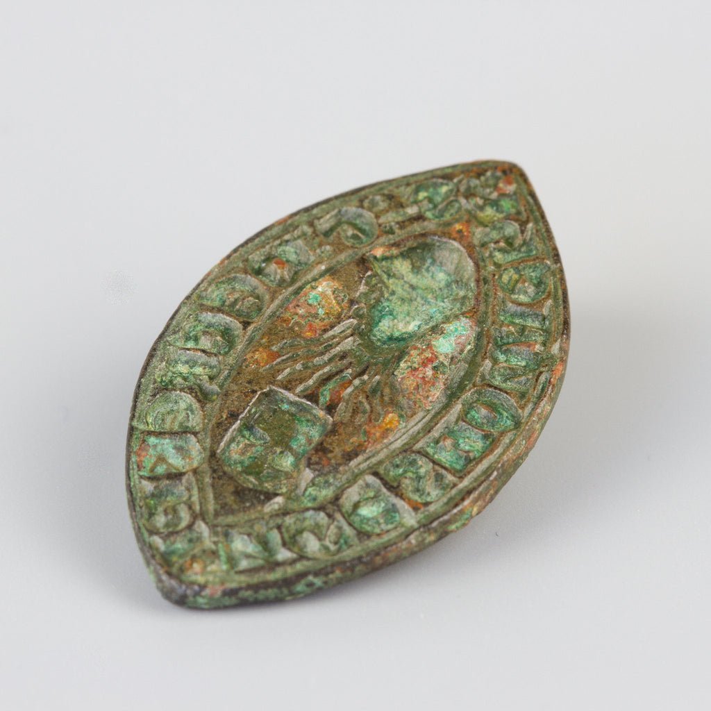Medieval lead wax seal engraved with central figure and inscription