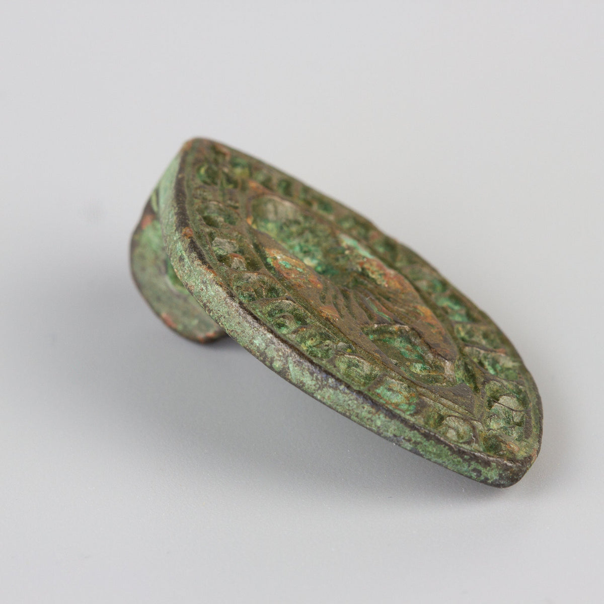 Medieval lead wax seal side profile showing engraved matrix