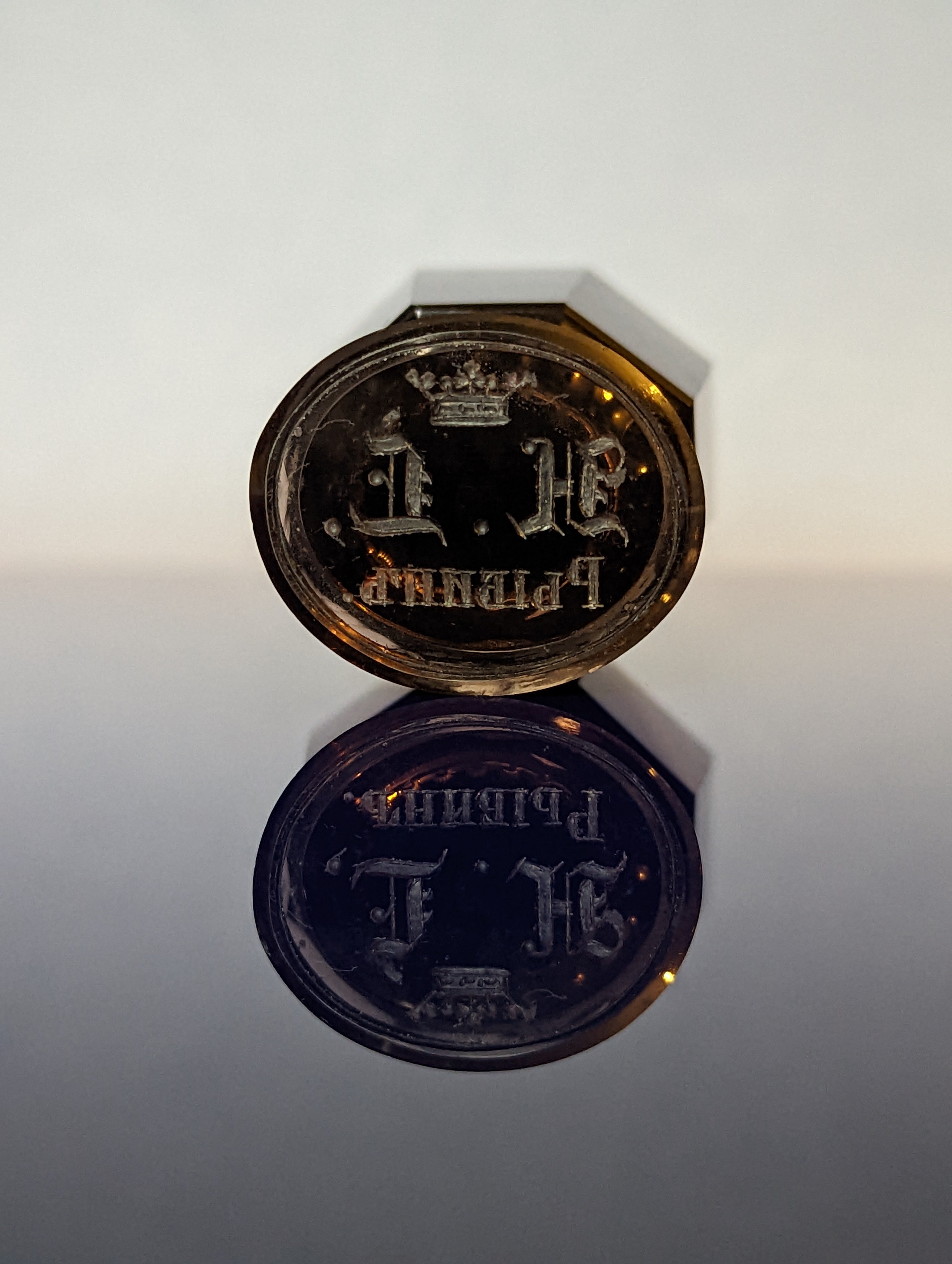Detial of engraved matrix on Russian smokey glass wax seal