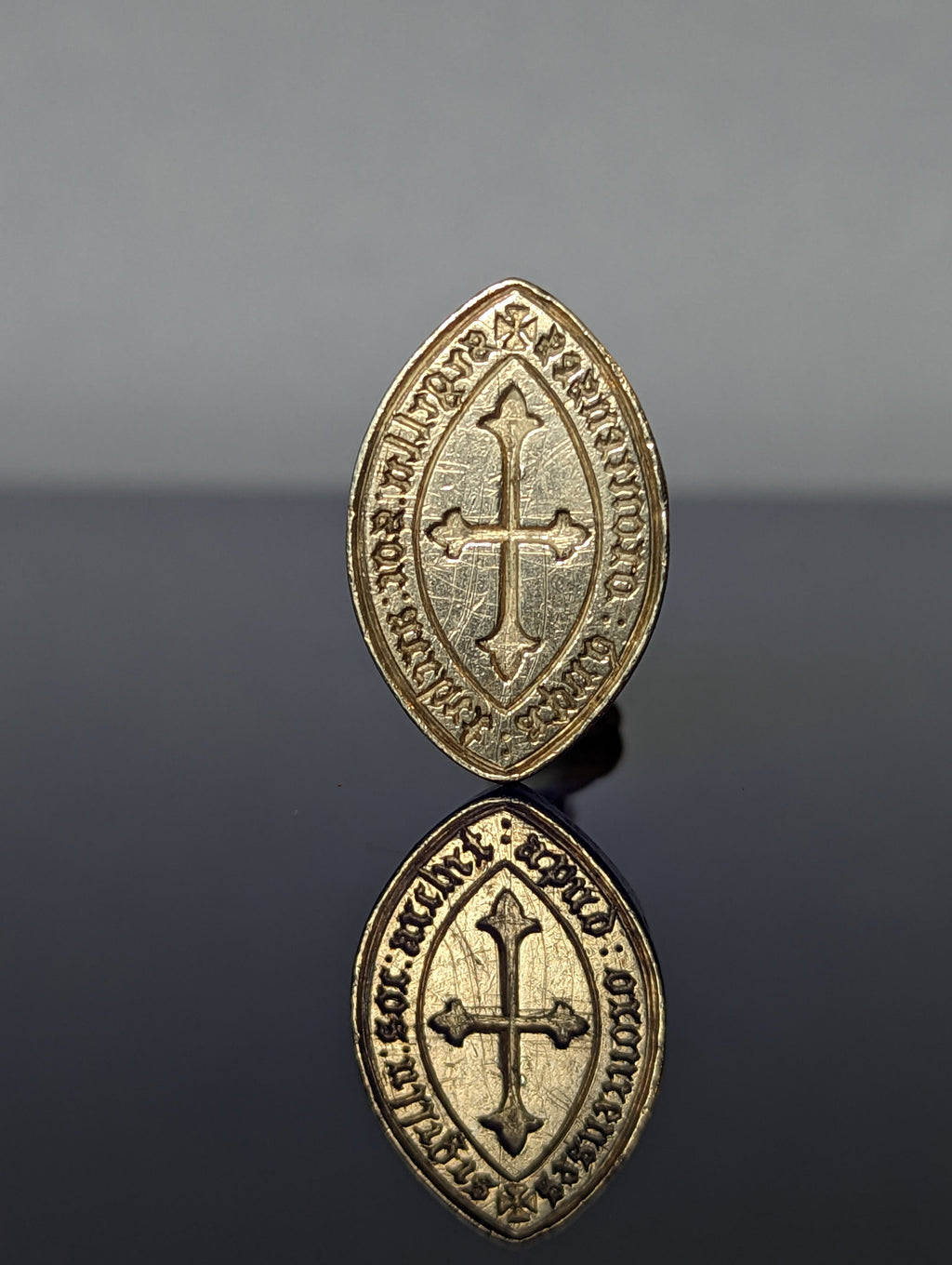 Detail of matrix showing cross and inscription Oxford Society