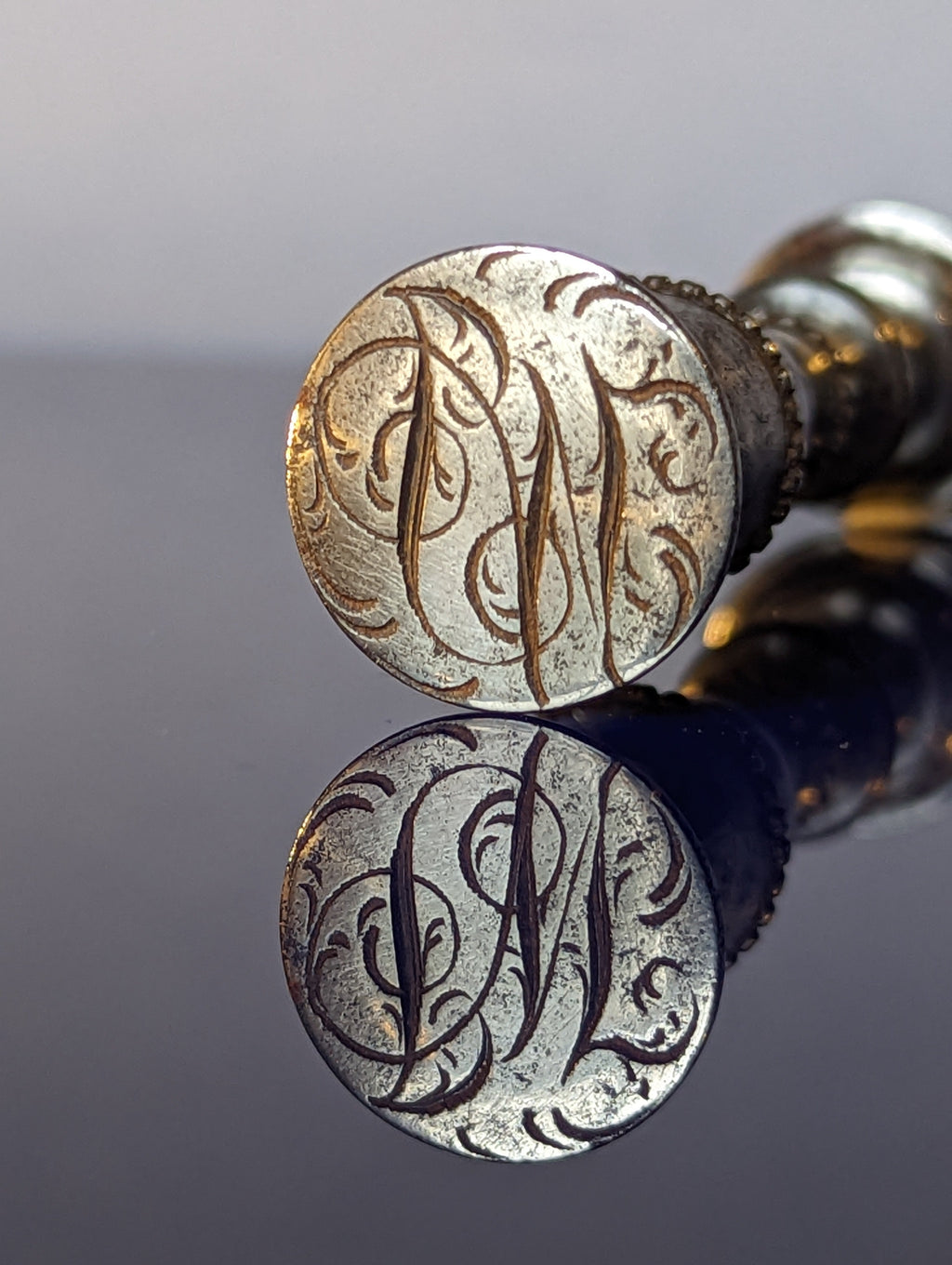 Detail of matrix showing cypher on steel wax seal