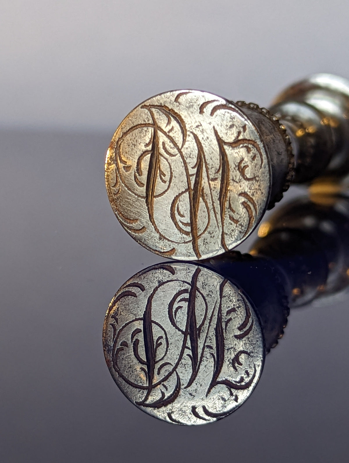 Detail of matrix showing cypher on steel wax seal