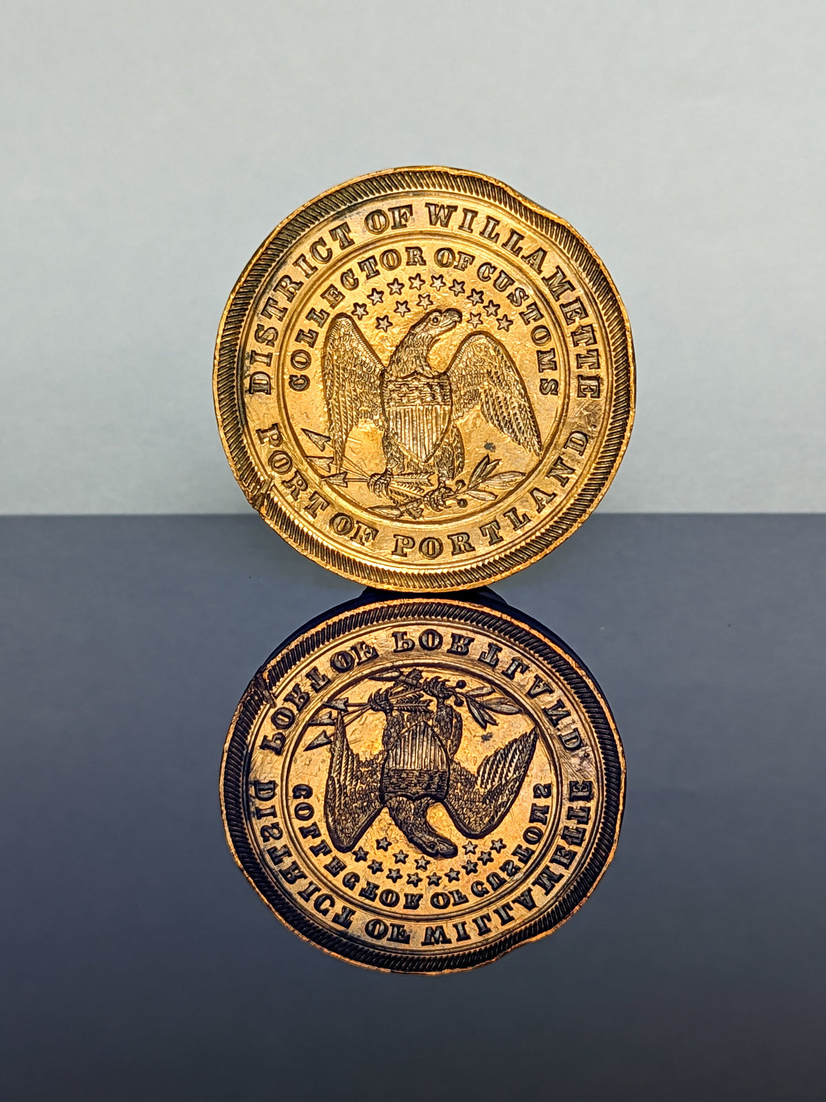 Detail of circular brass matrix of Portland customs desk wax seal