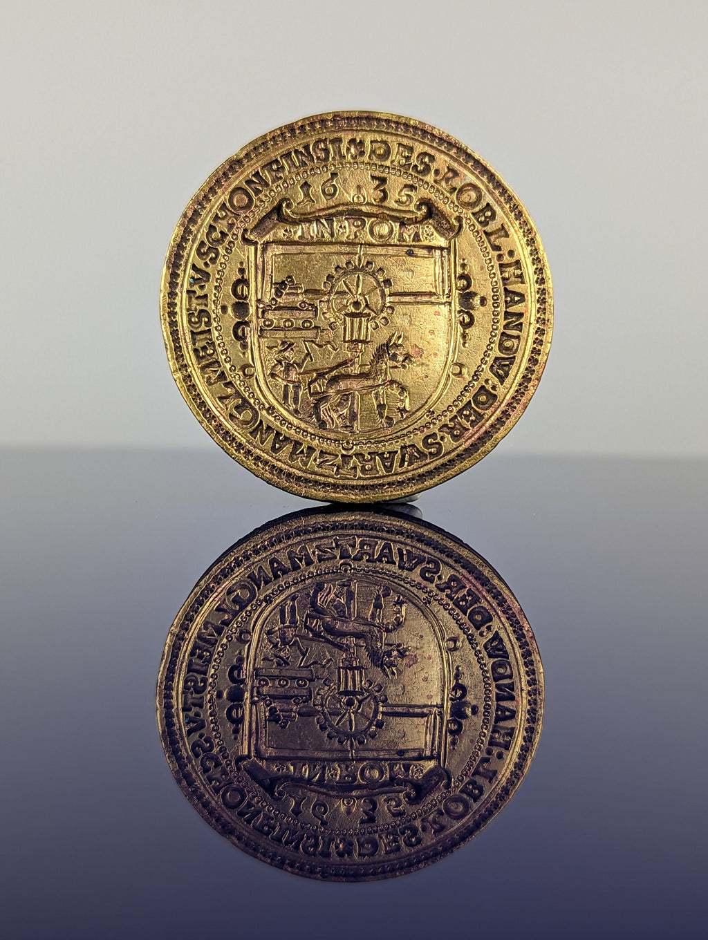 Matrix detail of Polish Guild seal showing hors and mill and circumscription