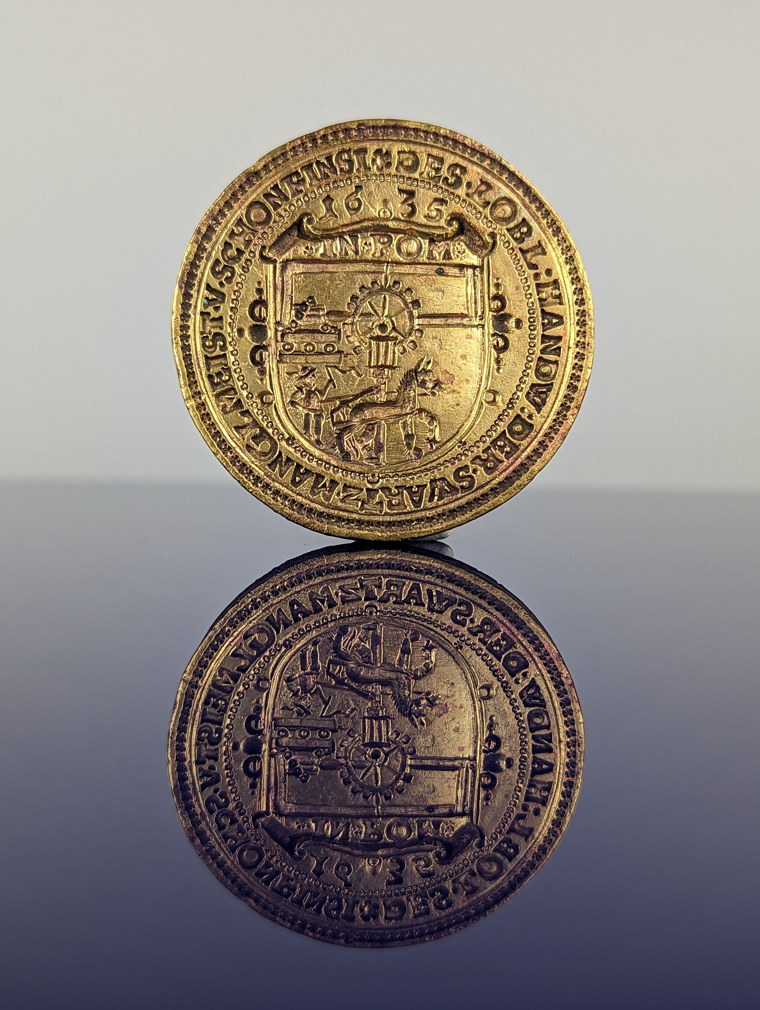 Matrix detail of Polish Guild seal showing hors and mill and circumscription