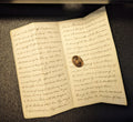 Gold cased perpetual wax seal on old letter